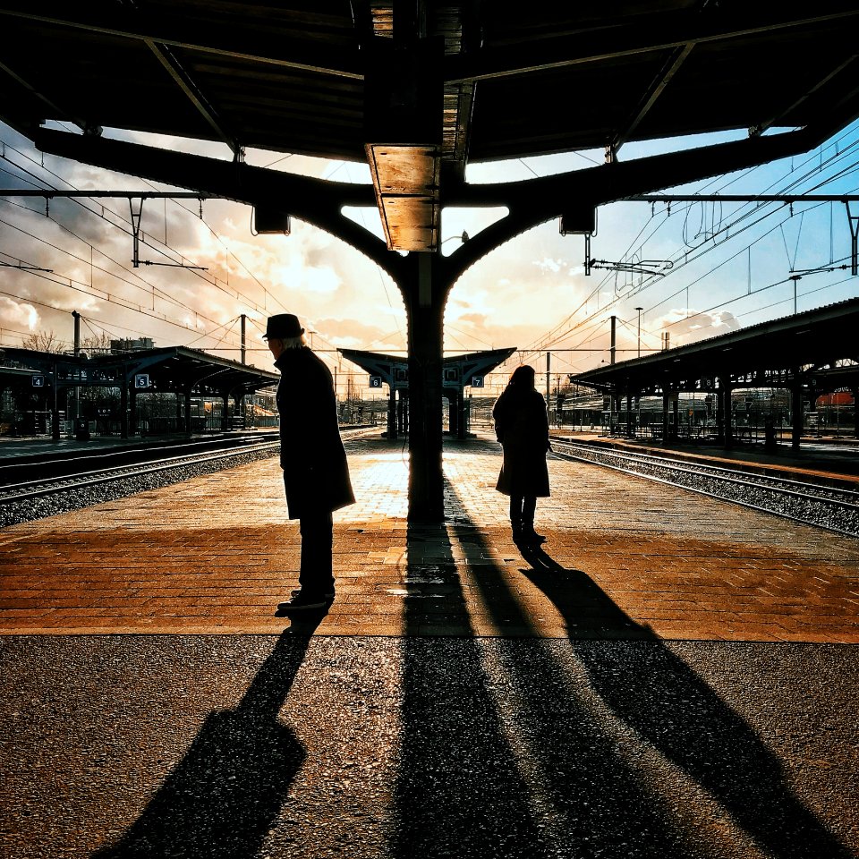 Man And Woman Silhouette Standing On Brown Ground At Daytime