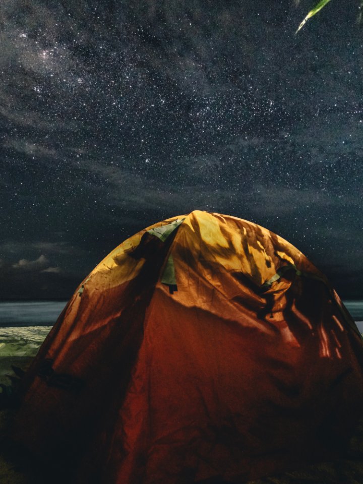Orange And Green Camping Tent Under Starry Sky
