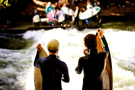 Two Men Wearing Black Wet Suits Holding Brown Wooden Surfboards photo