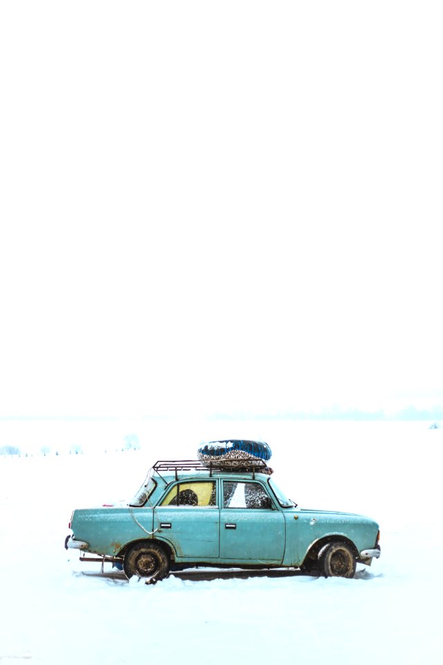 Blue Sedan On Snow