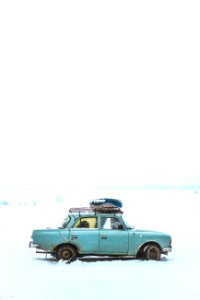 Blue Sedan On Snow