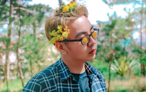 Photo Of A Man With Flowers On His Hair photo