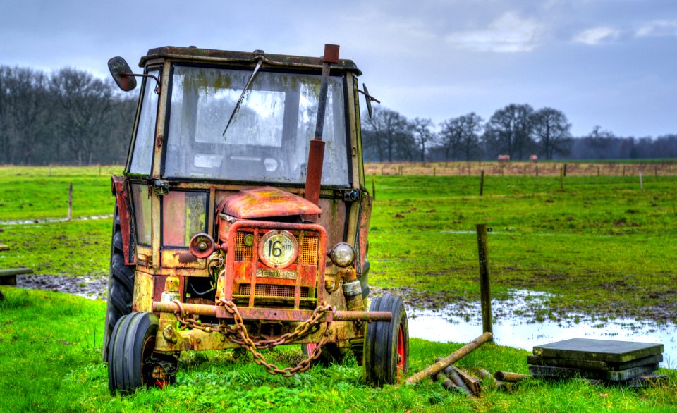 Yellow Farm Equipment On Green Grass Field