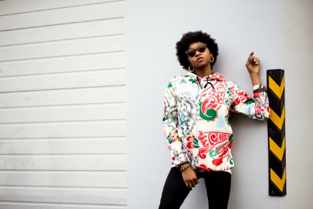 Woman In White And Red Floral Jacket