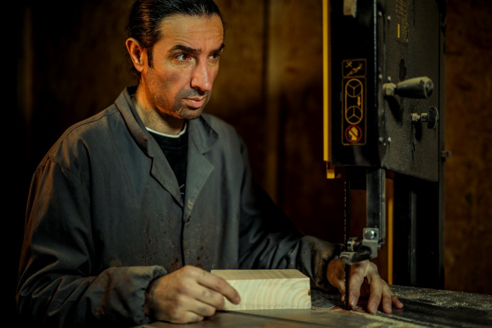 Man In Gray Dress Shirt Operating Band Saw
