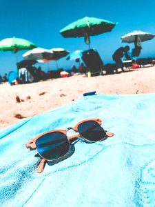 Brown Clubmaster Sunglasses On Blue Towel photo