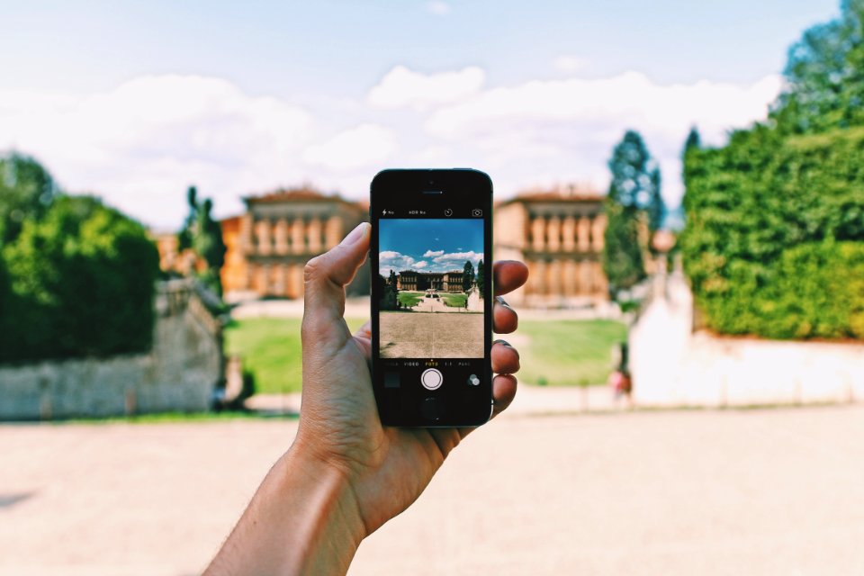 Person Using Space Gray Iphone 5s Taking A Picture Of Landmark During Day