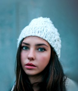 Woman Wearing Knitted White Hat With Nose Ring photo