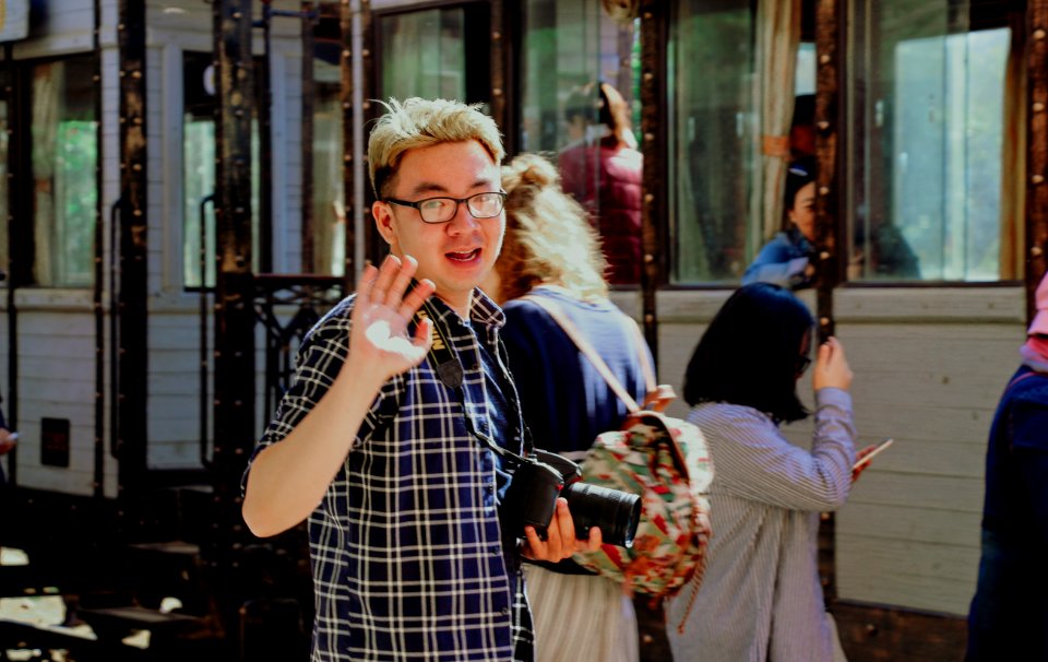 Man With Bridge Camera Waving photo