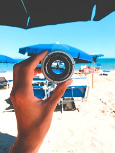 Person Holding Gray Lens