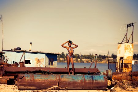 Woman Standing On Brown Steel Container Wearing Two-piece Bikini