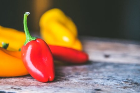Red Chili Pepper On Gray Wooden Surface photo