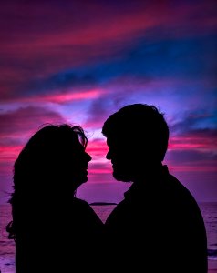 Silhouette Of Couple Facing Each Other photo