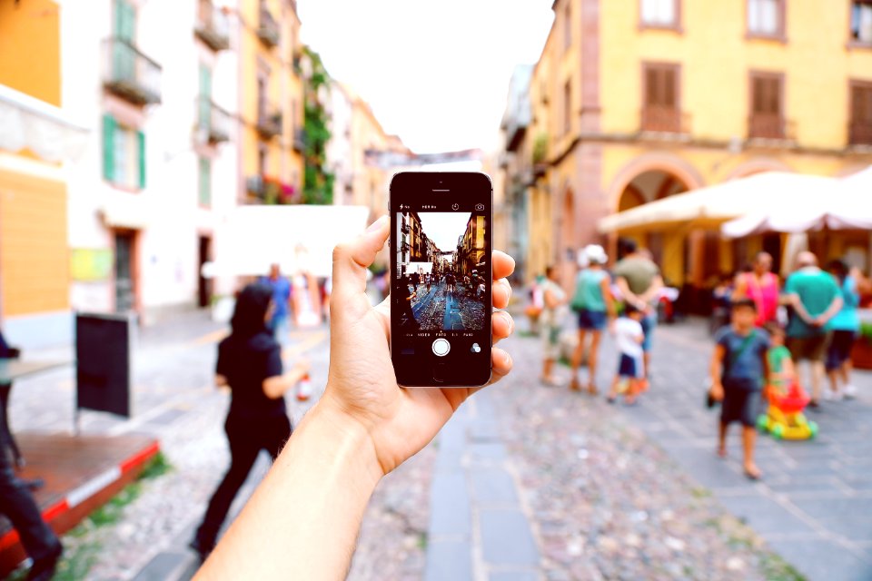 Person Holding Space Gray Iphone 5s
