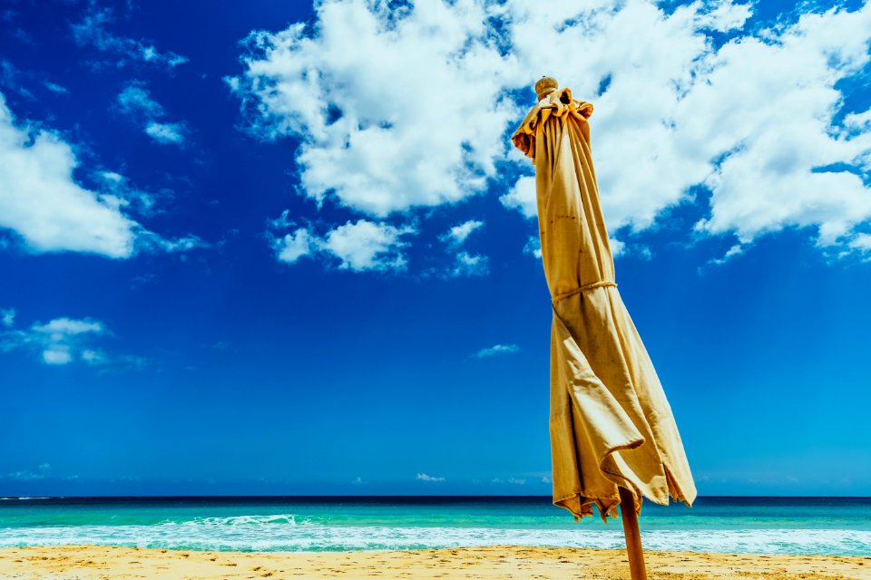 Brown Umbrella On Seashore