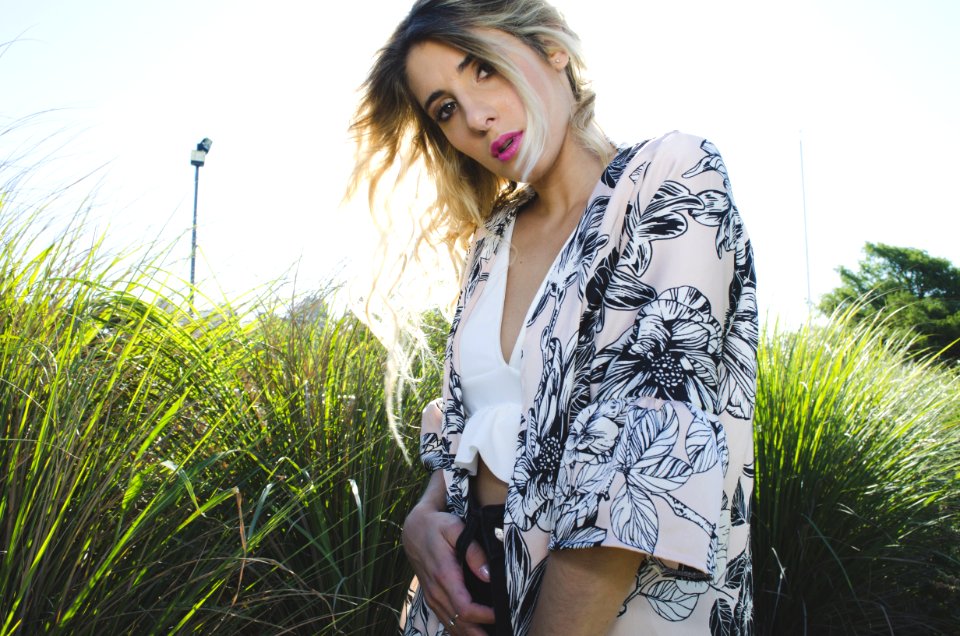Woman Wearing White Black And Gray Floral Print Cardigan