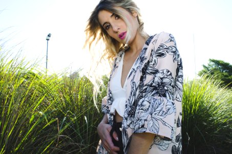 Woman Wearing White Black And Gray Floral Print Cardigan photo