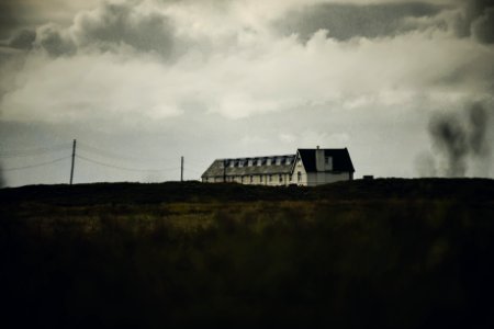White Concrete House Under White Clouds
