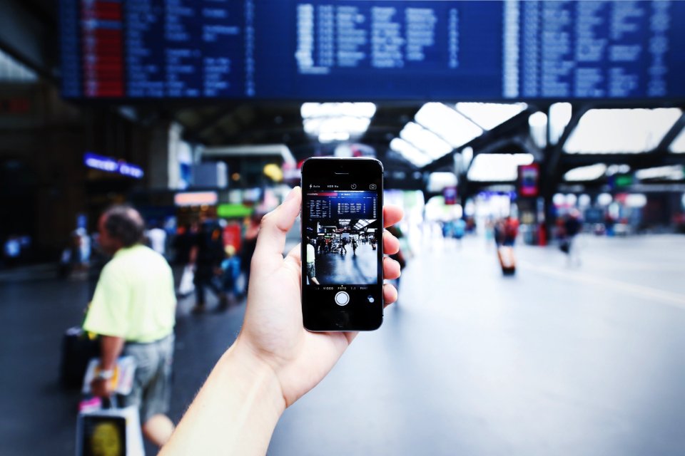 Person Holding Space Gray Iphone 5s On Camera Application
