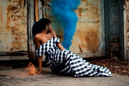 Photo Of Woman Wearing White And Black Gingham Dress Sitting On The Floor photo