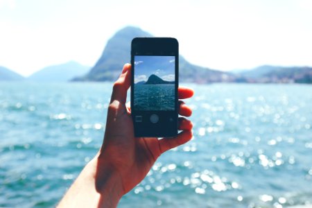 Person Taking Photo Of Mountain