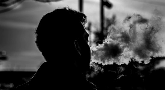 Grayscale Photography Of Man Smoking