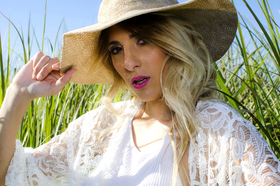 Blonde Hair Woman Wearing Brown Hat