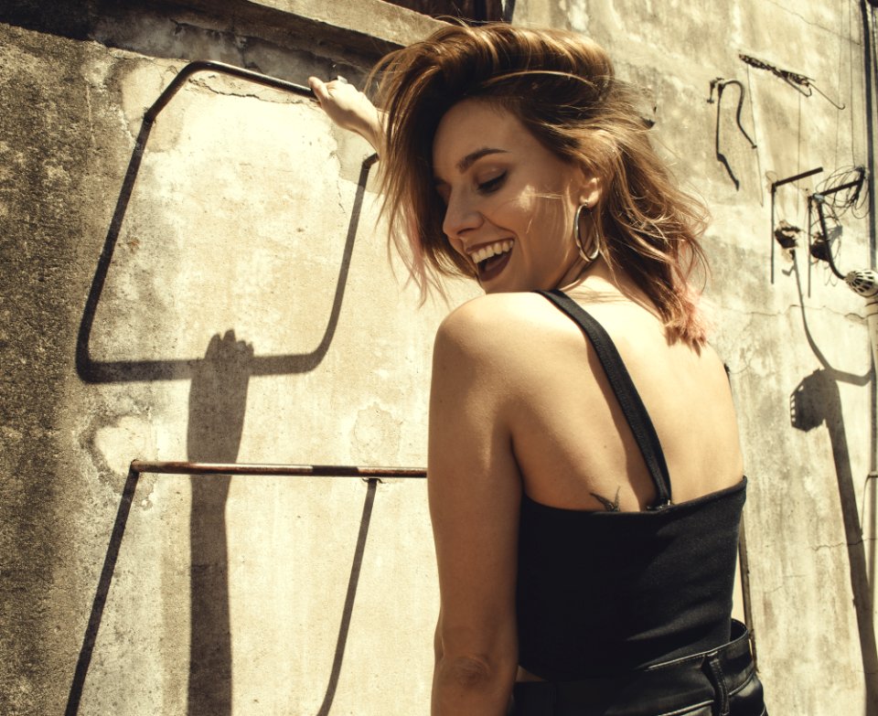 Photo Of A Woman Wearing Black Top