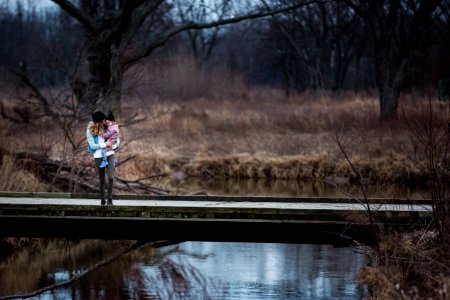 Photo Of Mother And Child Standing On The Bridge