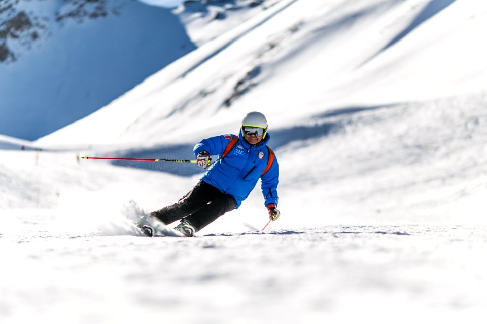 Man Snow Skiing On Bed Of Snow During Winter photo