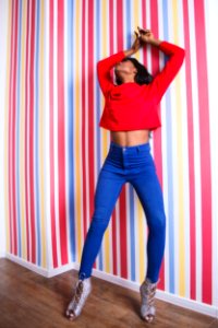 Woman Wearing Long-sleeve Crop-top And Blue Pants photo