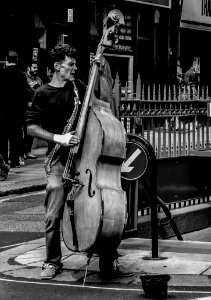 Grayscale Photography Of Man Playing Cello photo