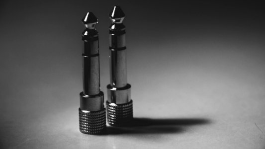 Two Gray Cordless Audio Jacks