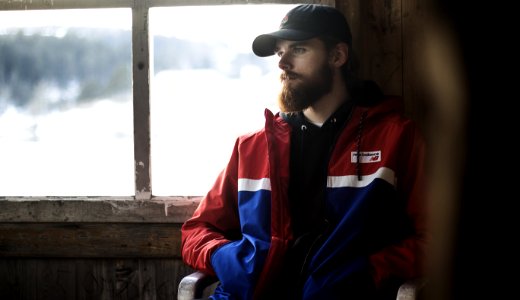 Man Wearing Blue Red And White Jacket