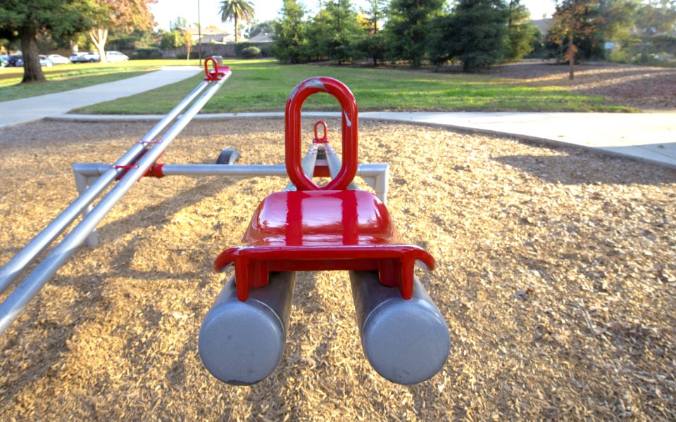 Red And Gray Seesaw In The Playground