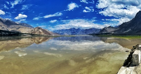 Body Of Water Near Mountain photo