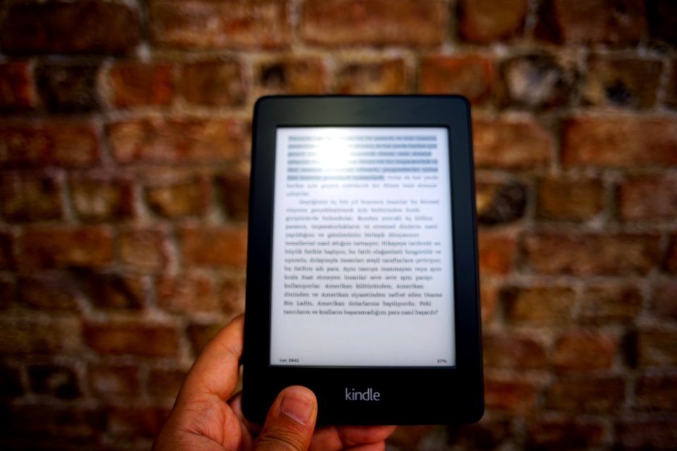 Person Holding Amazon Kindle Ebook