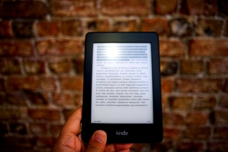 Person Holding Amazon Kindle Ebook