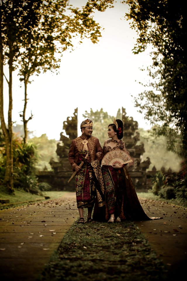 Man And Woman In Traditional Clothing Near Angkor Wat
