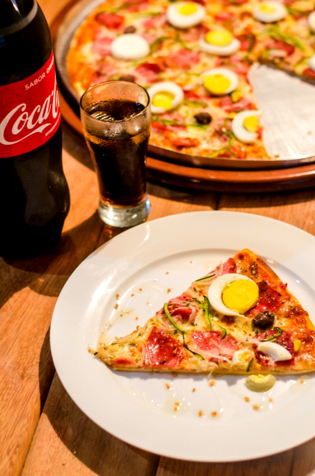 1-piece Sliced Pizza In White Ceramic Plate photo