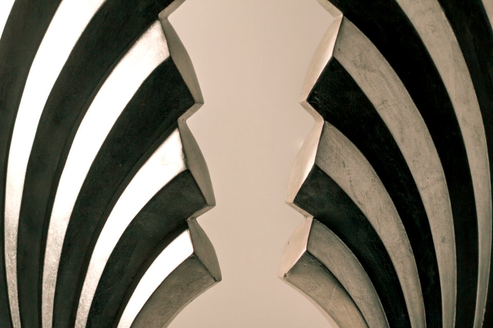 Gray And Black Steel Wall Decoration On White Surface