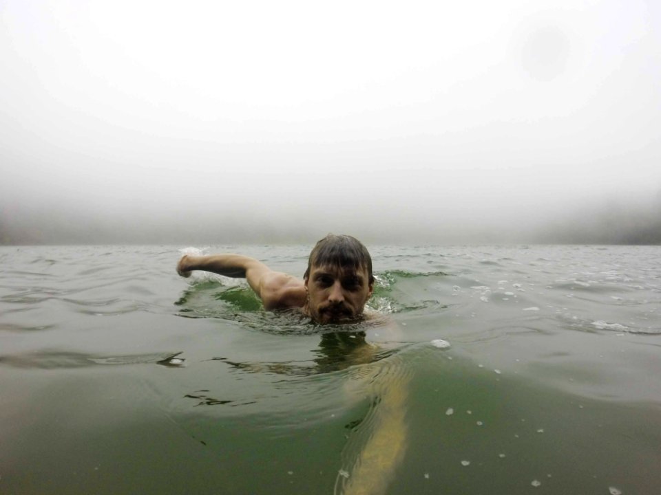 Man Taking A Photo Of Her In The Ocean