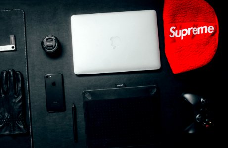 Macbook Beside Red Supreme Textile photo
