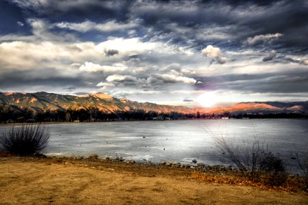 Landscape Photography Of Mountains Near Body Of Water photo