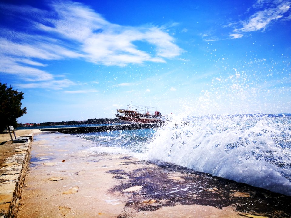 Photo Of Wave Under Clear Sky photo