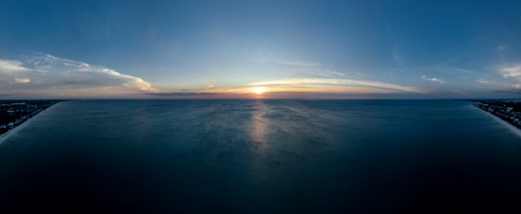 Scenic View Of Ocean During Sunset photo