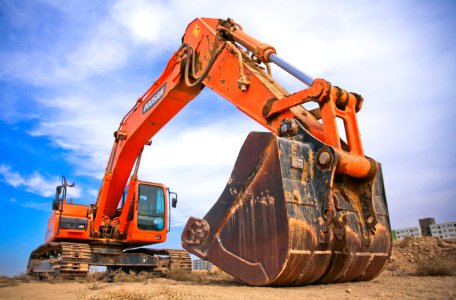 Red Excavator Under The Blue Sky