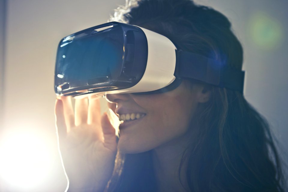 Man Wearing White Virtual Reality Goggles