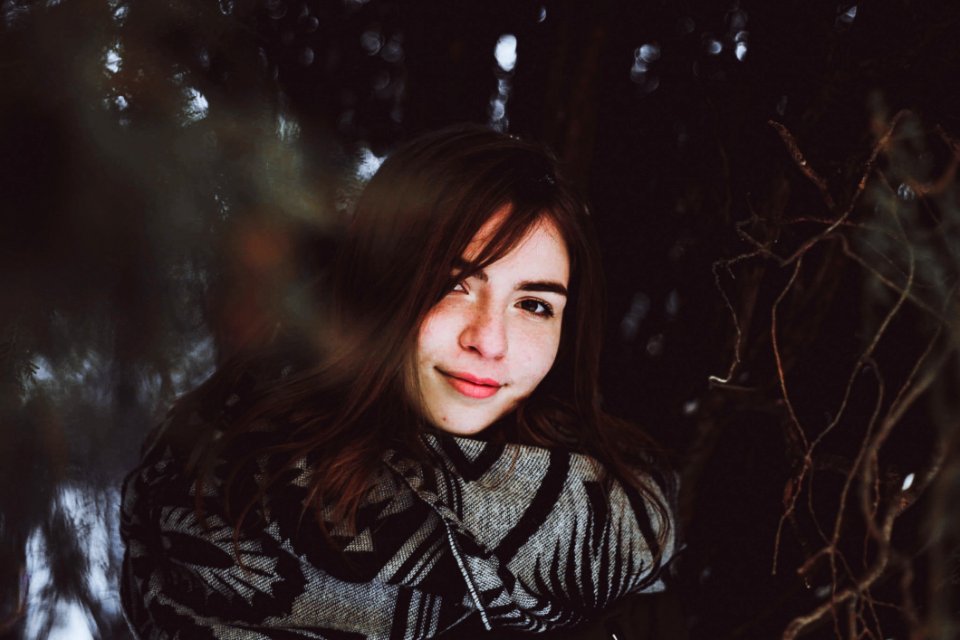 Woman In Black And Gray Sweater Posing Smile For Photo