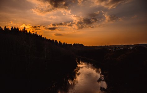 Silhouette Of Trees Beside River photo